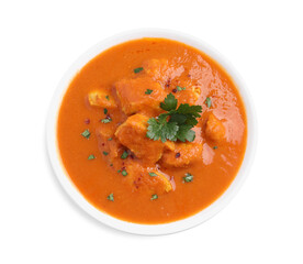 Bowl of delicious chicken curry on white background, top view