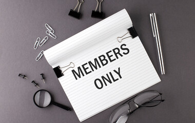 Text MEMBERS ONLY on Notebook and office tools on the gray desktop