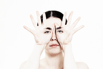World Mental Health Day. Portrait of a Caucasian woman holding her hands to her face,. On the palms...