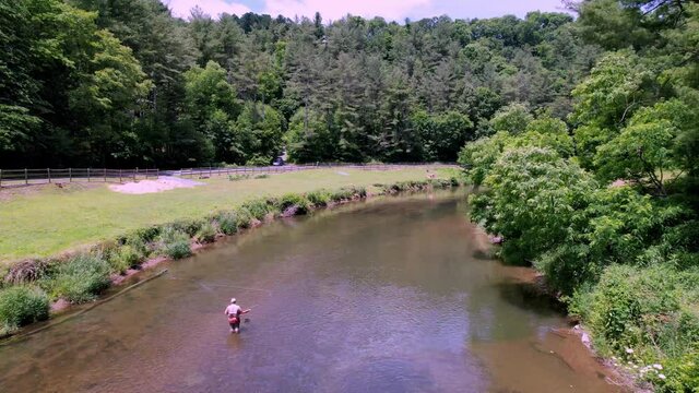 Aerial Push over Fly Fisherman along the New River in Watauga County NC, Watauga County North Carolina near Boone NC