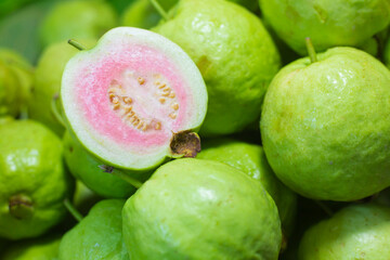 Thai red guava is a traditional Thai fruit, it has green color outside skin and red or pink flesh. It is highly vitamin C fruit.