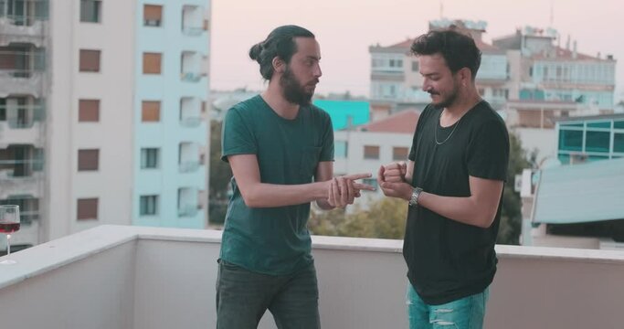 Young friends are rock paper scissors on holiday time. Cheerful friendship and game concept.