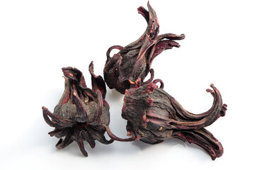 Dried hibiscus sabdariffa or roselle fruits on white background. Herbal tea © Yuphayao Pooh's