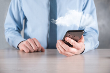 Businessman hand holding cloud.Cloud computing concept, close up of young business man with cloud over his hand.The concept of cloud service.
