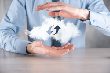 Cloud technology. Polygonal wireframe cloud storage sign with two arrows up and down on dark ....