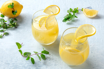 Fototapeta premium Lemonade. Homemade fresh lemon drink. Fresh beverage. Refreshing citrus ice tea. Healthy summer beverage. Natural detox diet