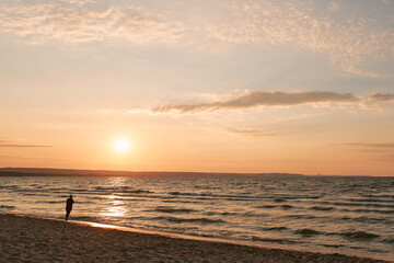 Evening landscape view of the Baltic sea. Sunset over the sea with beach