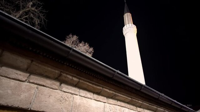 Minaret and dome of Gazi Husrev-bey Mosque in Sarajevo at night, Bosnia and Herzegovina