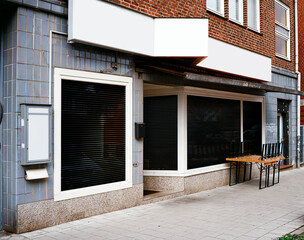 closed and locked sushi restaurant in the urban city, impact of the coronavirus pandemic 2021 in...