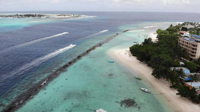 Aerial view of a hydrocycle in a deep blue colored sea