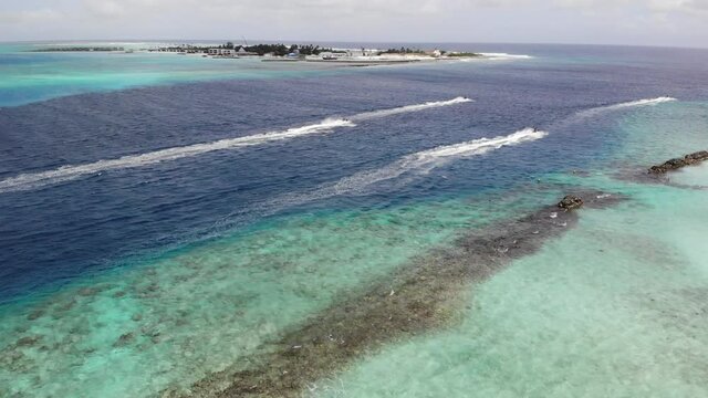 Aerial view of a hydrocycle in a deep blue colored sea