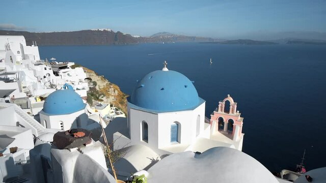 Iconic Santorini - most beautiful island in Europe. view with traditional churches in Oia village. Greece