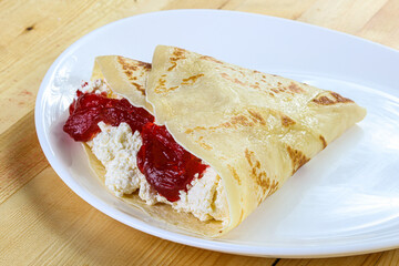 Pancake with cottage cheese and jam