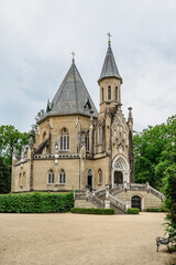 Obraz premium Spring view of Schwarzenberg Tomb near Trebon, Czech Republic.Neo-gothic building with tower and majestic double staircase is surrounded by English park.Architectural popular tourist monument