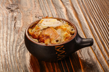 Casserole cocotte with baked cheese