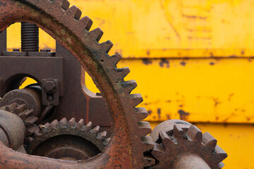 Old rusty big cogs of a steel machiner, Close up.