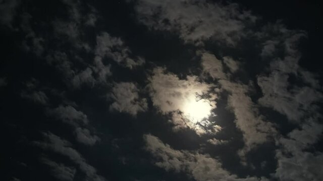 Moonlit clouds at night timelapse