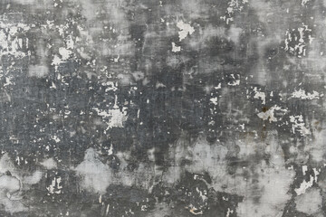 abstract gray painted old wall for background or texture, peeling paint and stucco with cracks like grunge style