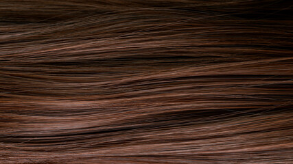 Macro shot of beautiful healthy long smooth flowing brown hair.