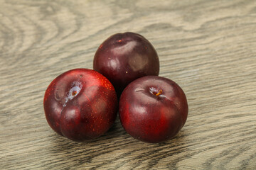 Ripe sweet plum fruit heap