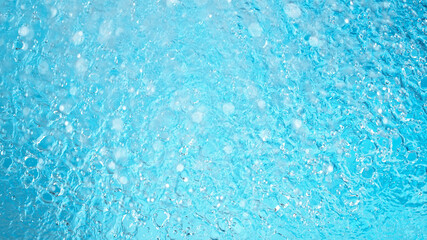 Fototapeta na wymiar Blue water surface background, studio shot, texture of splashing abstract water shape
