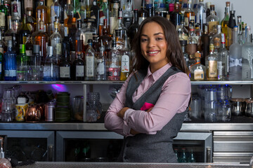 Confident Hispanic woman working in bar