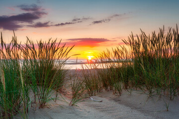 A beautiful sunset on the beach of the Sobieszewo Island at the Baltic Sea. Poland