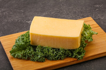 Tasty yelloow Tilsiter cheese brick