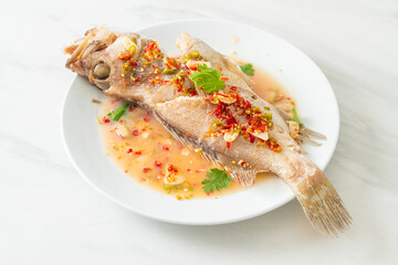 Steamed grouper fish with lime and chillies