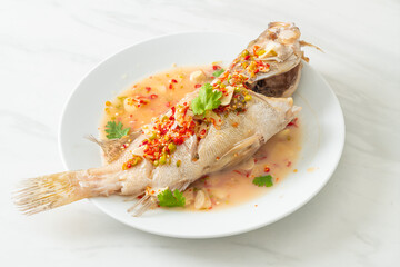 Steamed grouper fish with lime and chillies