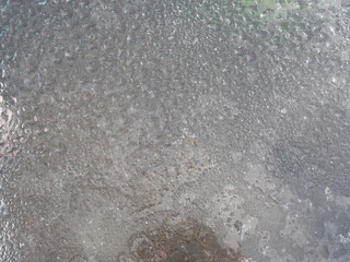 Obraz premium Opaque wet glass with embossed pattern. Top view. Full screen photo. Not seamless texture