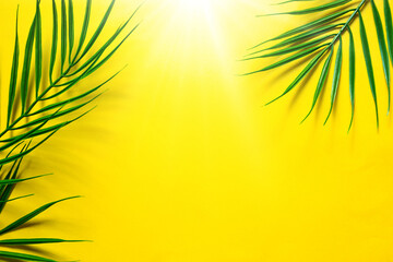 Fototapeta na wymiar Yellow summer background with palm leaves-the theme of the beach, tropical holidays, hot sun. Frame, copy space.