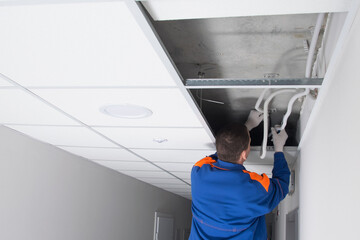 the master has opened the ceiling and understands the intricate wiring of utility networks