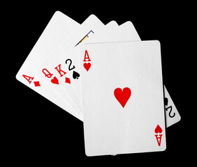 Classic playing cards for poker and gambling, isolated on black background, clipping path