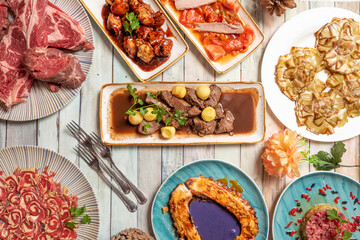  typical Spanish dishes with meat tacos, grilled octopus and cabbage cream, salad, tuna tartare, artichoke flowers, tuna belly on peppers