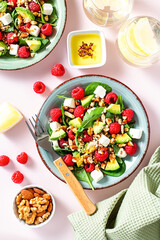 Light summer salad with raspberry, walnuts, avocado and cheese