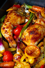 fried chicken legs with various vegetables