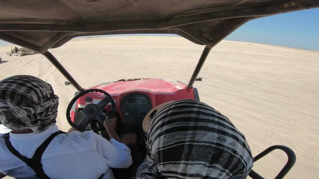 EDITORIAL GO PRO???? Couple driving a buggy car through the desert - thrill safari adventures, POV