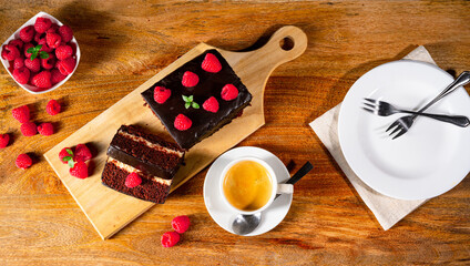 Fototapeta na wymiar Chocolate cake with raspberries and coffee