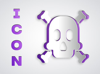 Paper cut Bones and skull as a sign of toxicity warning icon isolated on grey background. Paper art style. Vector