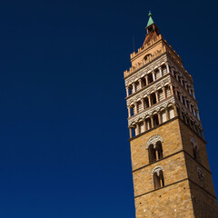 Fototapeta na wymiar Pistoia cathedral medieval bell tower, a city landmark, erected in the 12th century (with copy space)