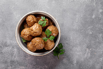  Traditional swedish meatballs in a bowl on gray background top view copy space for text