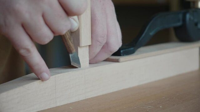 Joiner makes a mark with a knife Making handmade furniture