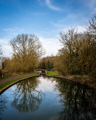 Fototapeta na wymiar Canal with blue sky and reflection