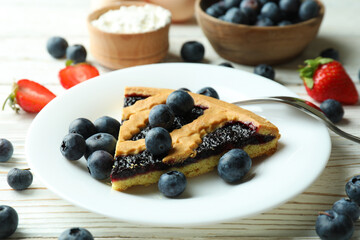Concept of delicious dessert with blueberry pie, close up