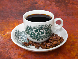 cup of coffee with beans-Traditional Kopi O commonly served in Malaysia and Singapore.
