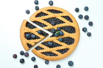 Delicious blueberry pie and blueberries on white background