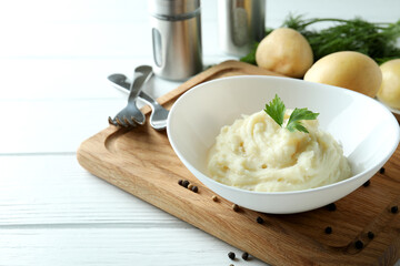 Concept of tasty eating with mashed potatoes on white wooden table