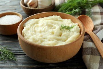Concept of tasty eating with mashed potatoes on wooden table