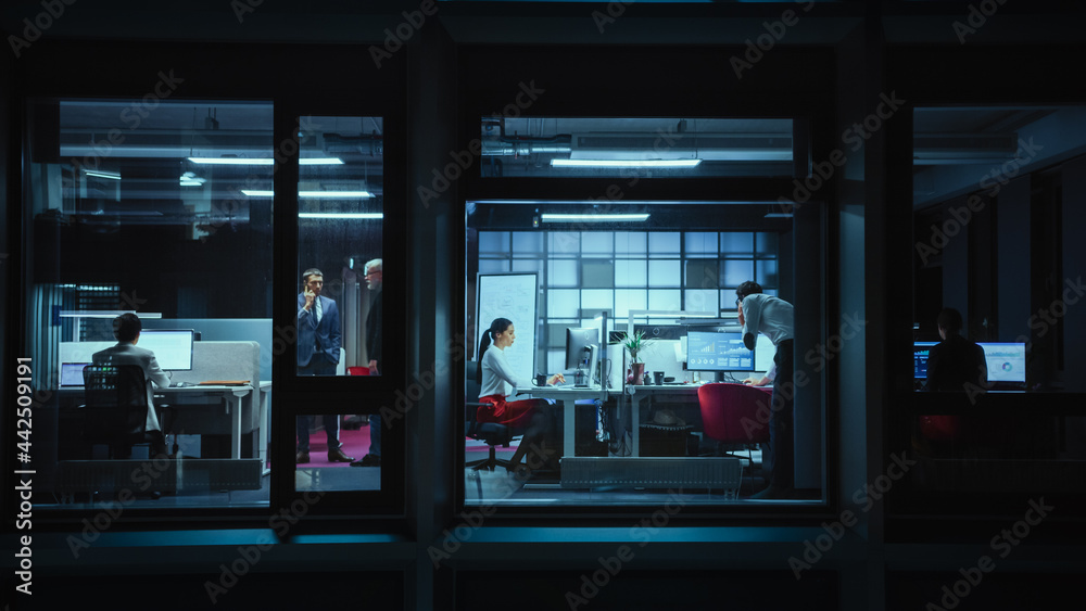Aufkleber Shot from Outside: Businessman Working on a Digital Tablet Computer in the Office. Manager Checking Emails while Standing by the Window. Employee Planning Financial Tasks and Business Development.